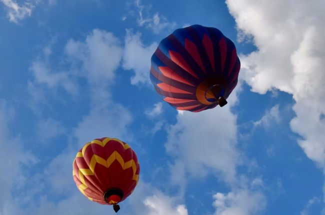 2 hot balloons up in the sky in Warren County New Jersey